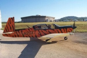 AVweb's Liz Swaine and Mooney's Tom Bowen pause on the ramp at Kerrville before putting the Predator through its paces.