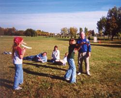 Launching a rubber band-powered balsa wood airplane.